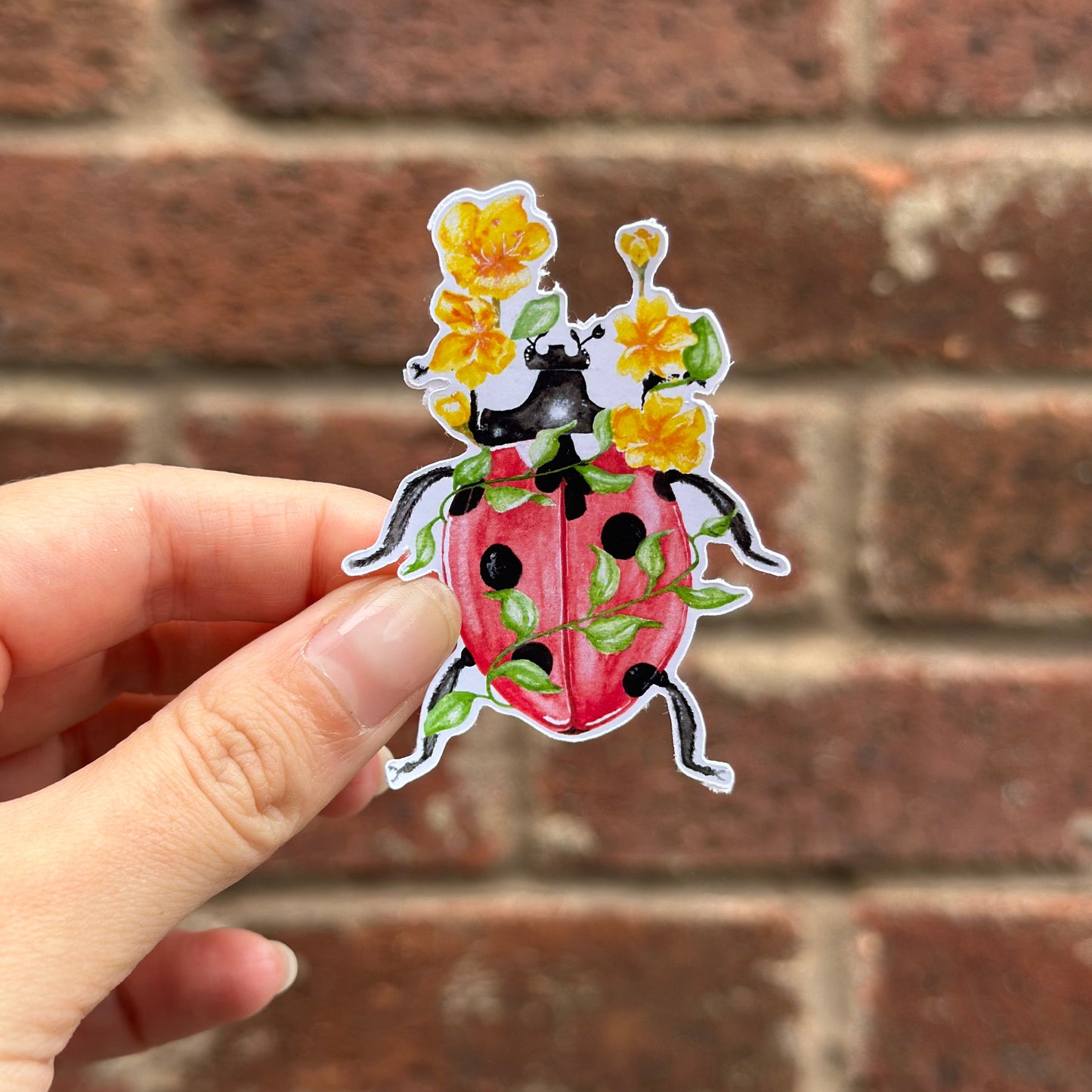 Nature centred ladybug with flowers sticker. Frontal
UK Small shop