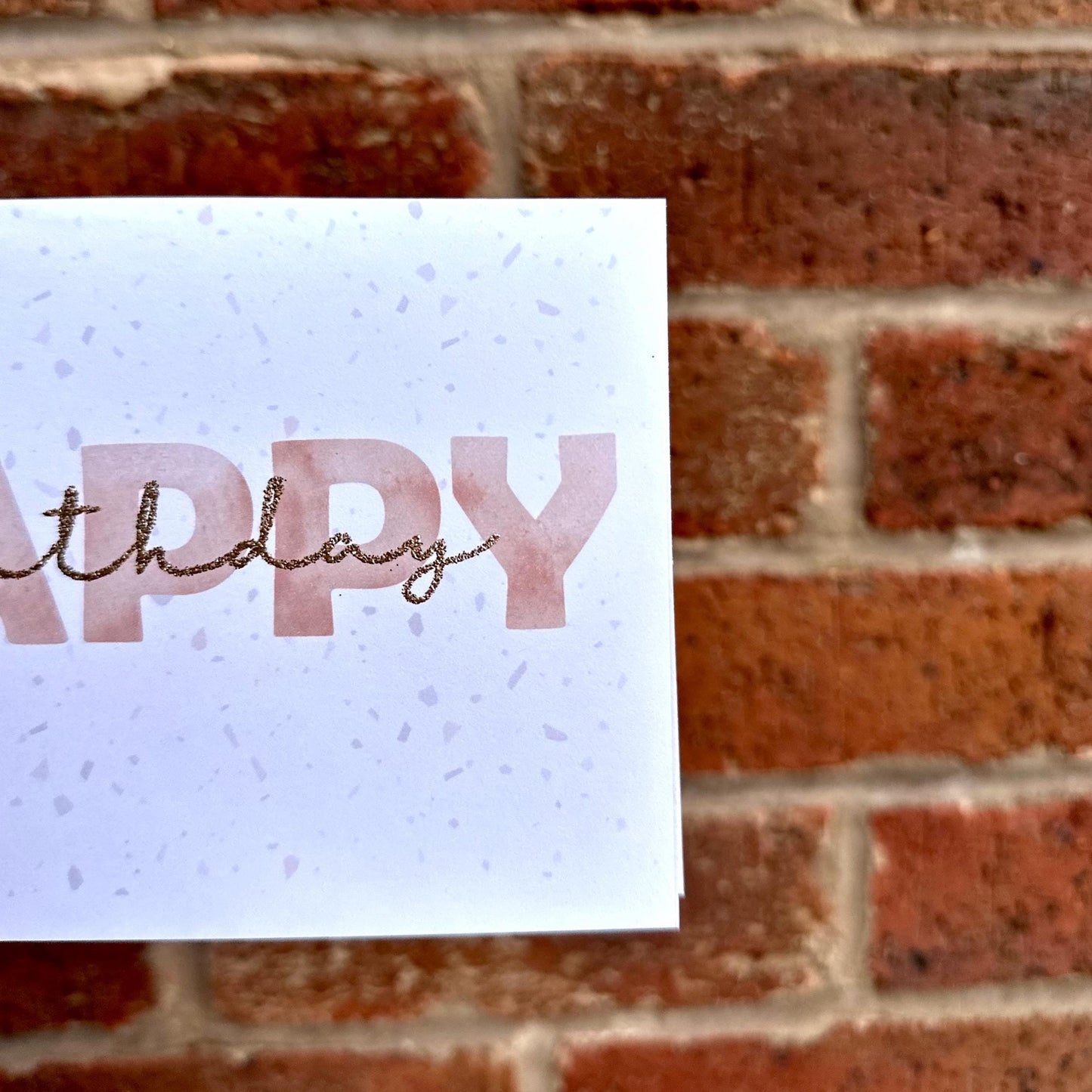 Aesthetic terrazzo detail Happy Birthday card with glitter birthday text. Frontal detail