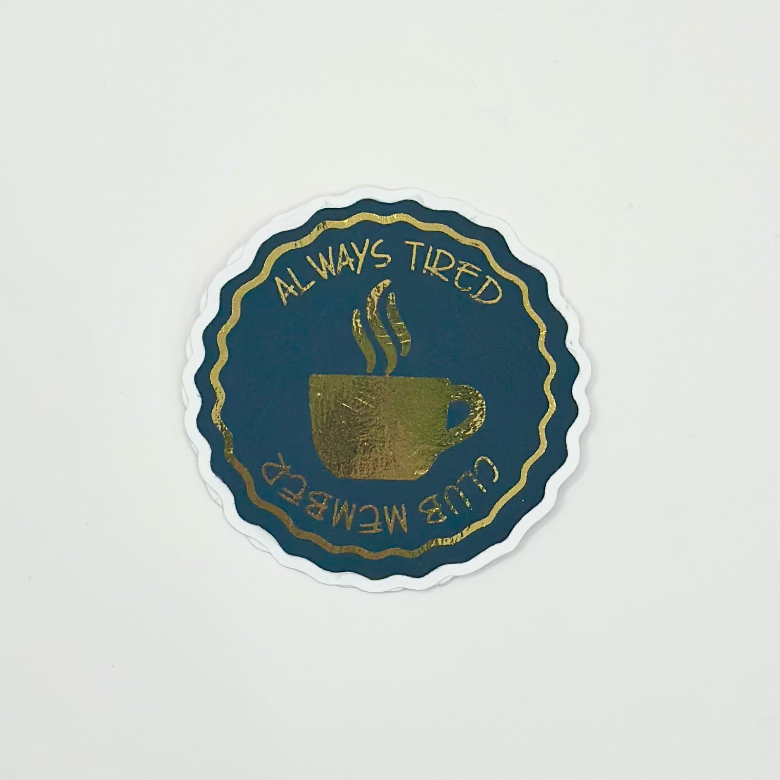 aestetic sticker with a coffee cup design and text 'Always Tired Club Member' with gold details on white background. Top View
UK Small shop