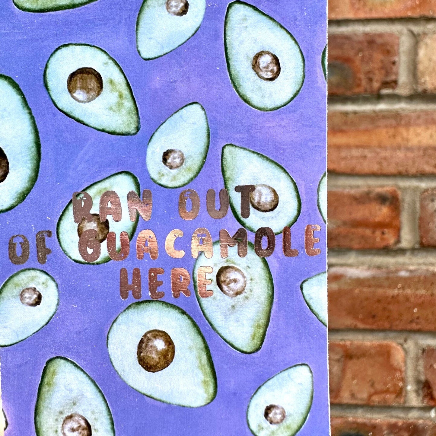 Avocado themed aethetic bookmark with golden text 'ran out of guacamole here'. Front detail