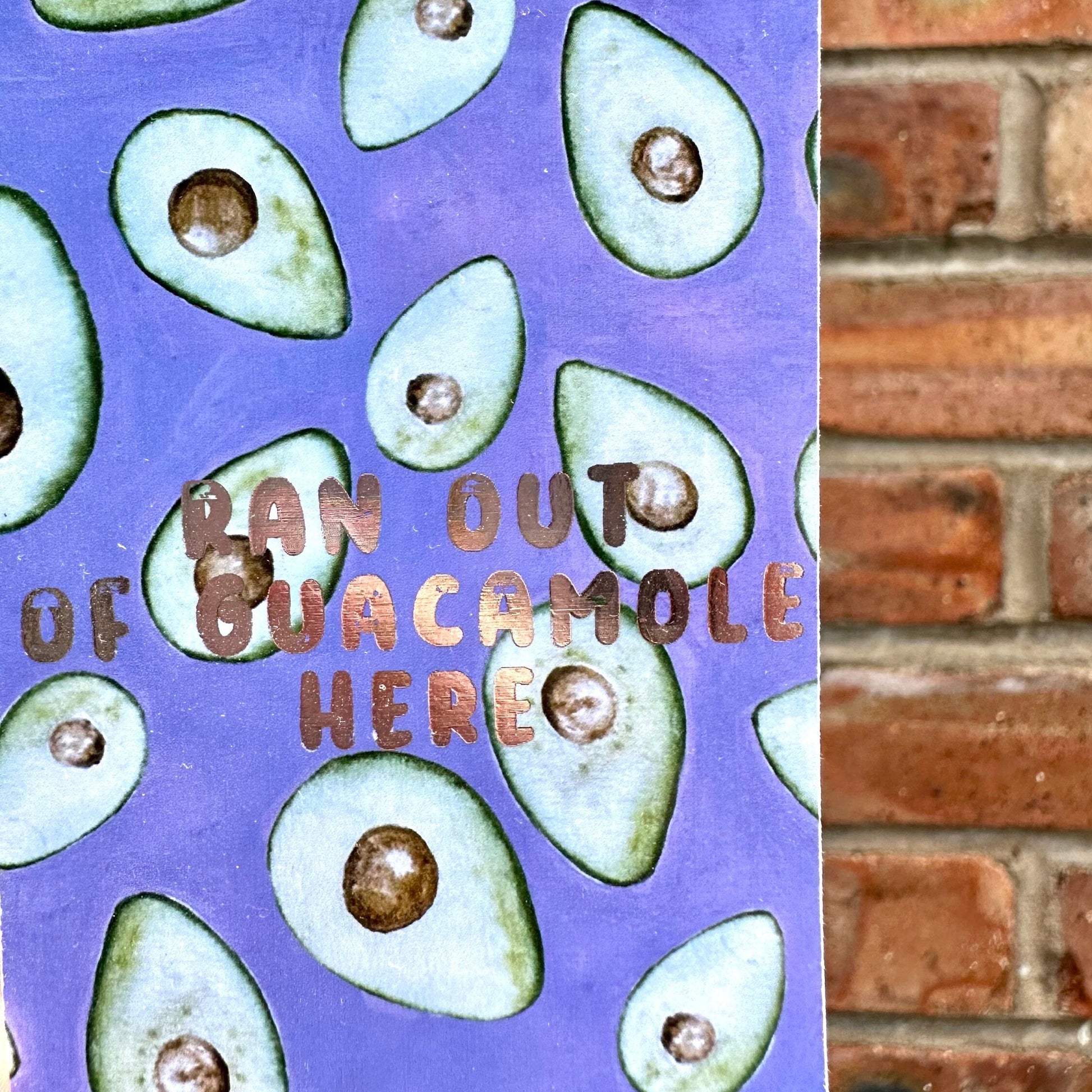 Avocado themed aethetic bookmark with golden text 'ran out of guacamole here'. Front detail