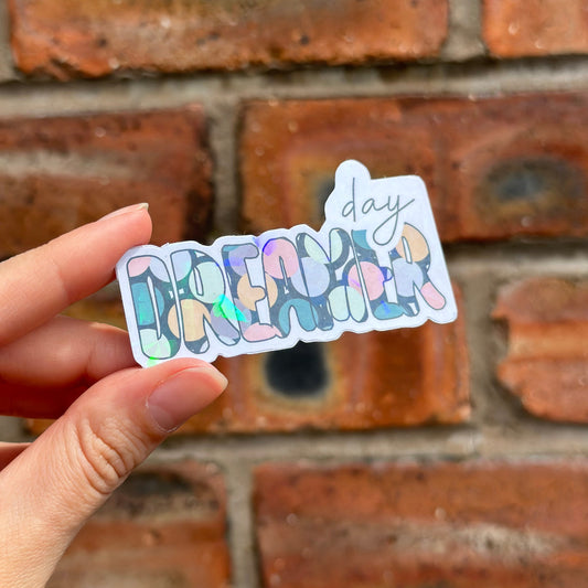 Holographic colourful daydreamer sticker. Frontal
UK Small shop