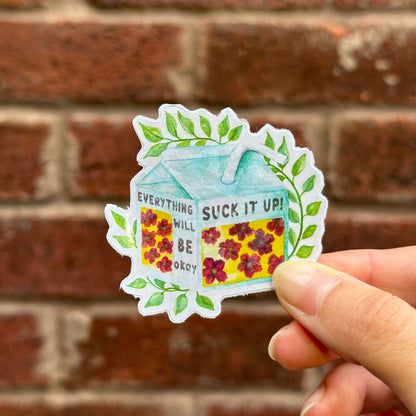 Aesthetic motivation sticker resempling juice cartoon with text 'suck it up! everything will be okay' and floral motives. Frontal