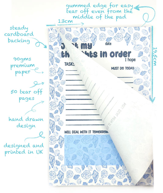 Notebook with coastal design and tear-off pages, featuring 'Just my thought in order' text and measurements.