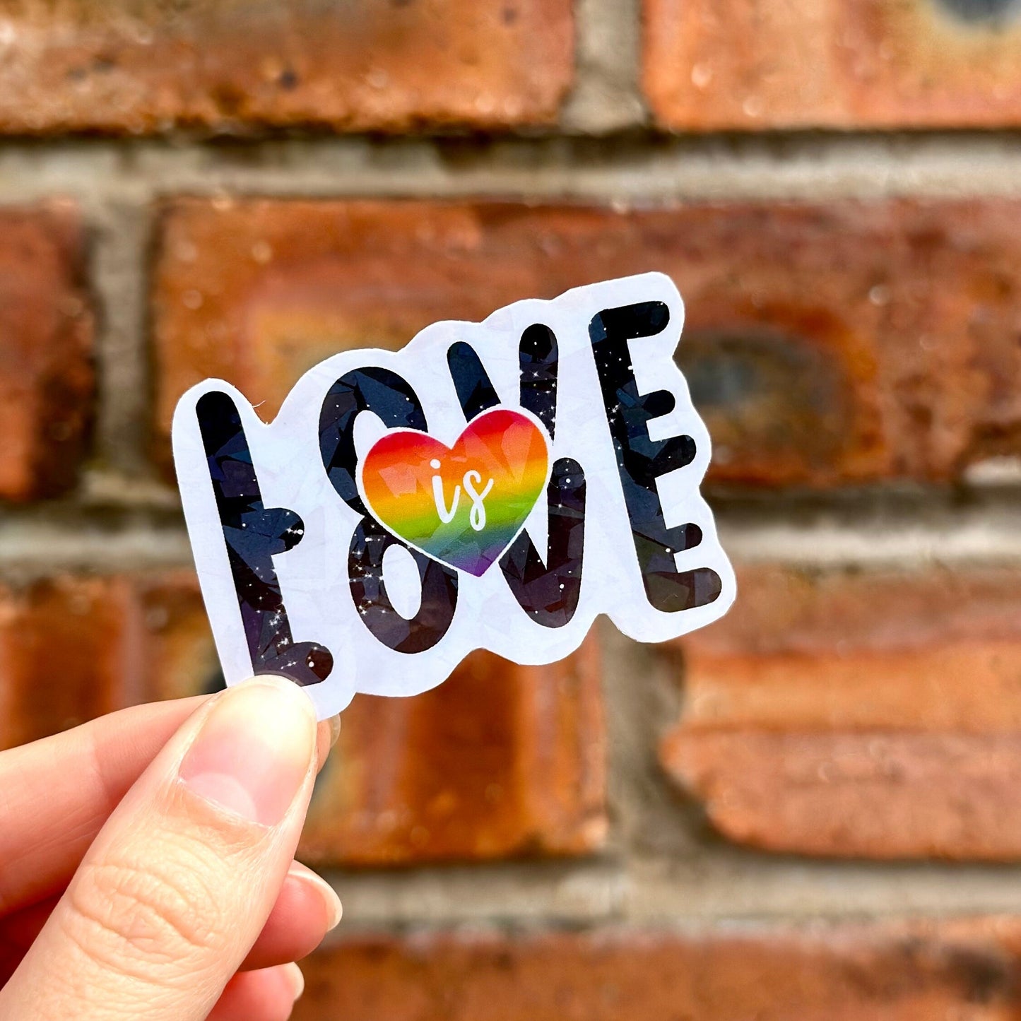 lgbtq love is love colorful heart sticker with glossy finish. Frontal