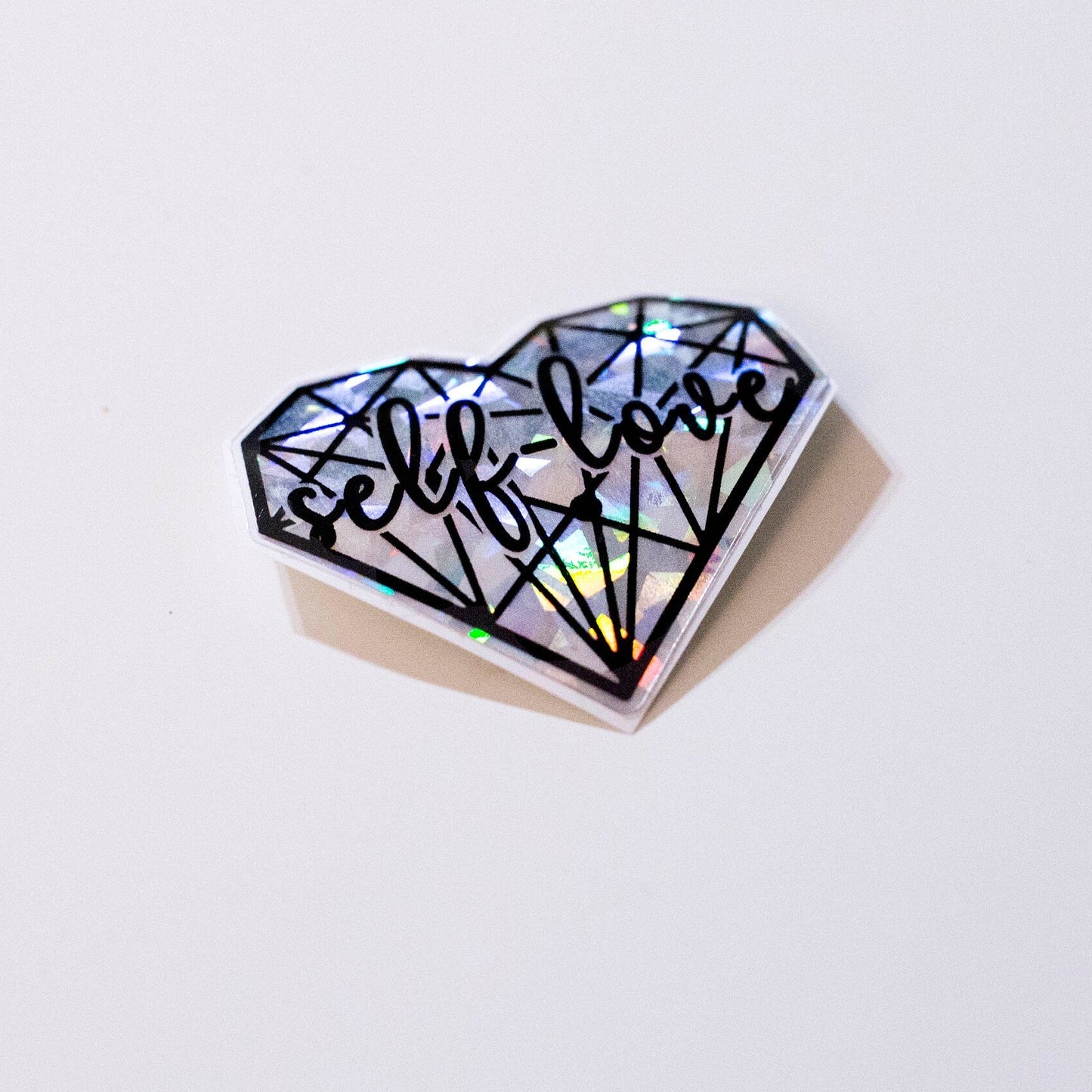 silver broken glass aesthetic self love heart sticker. side view