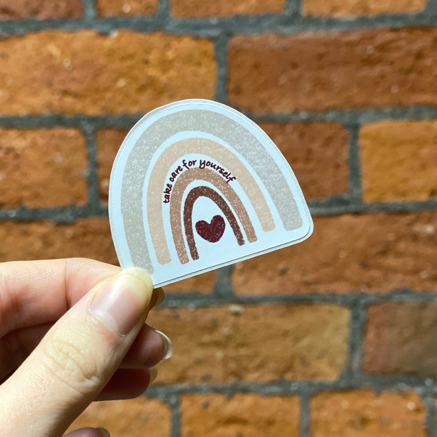 Aesthetic color rainbow sticker with 'take care for yourself' text. Frontal