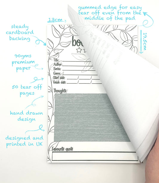 Book review pad with tear-off pages and floral design details on a white background