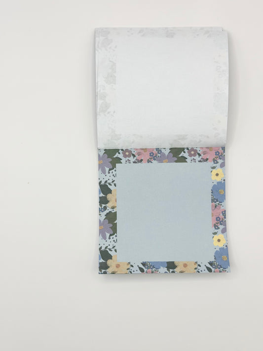 open square memo pad with floral design on white background