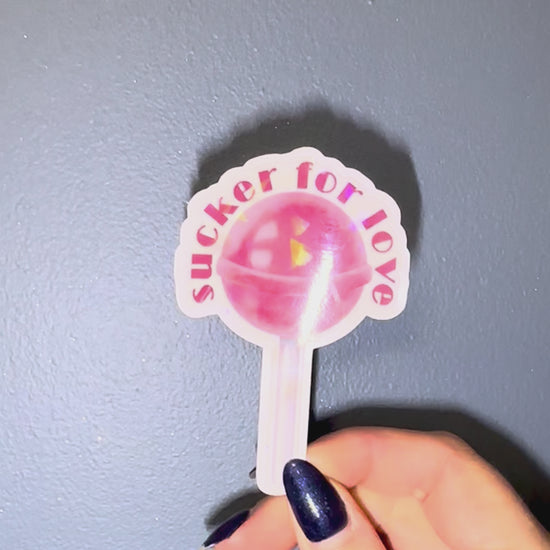 lollipop shaped sticker agains blue wall