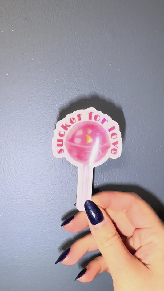 lollipop shaped sticker agains blue wall