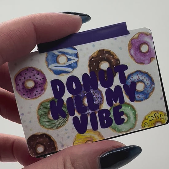 Video of magnetic bookmark featuring hand drawn donuts and text 'donut kill my vibe'