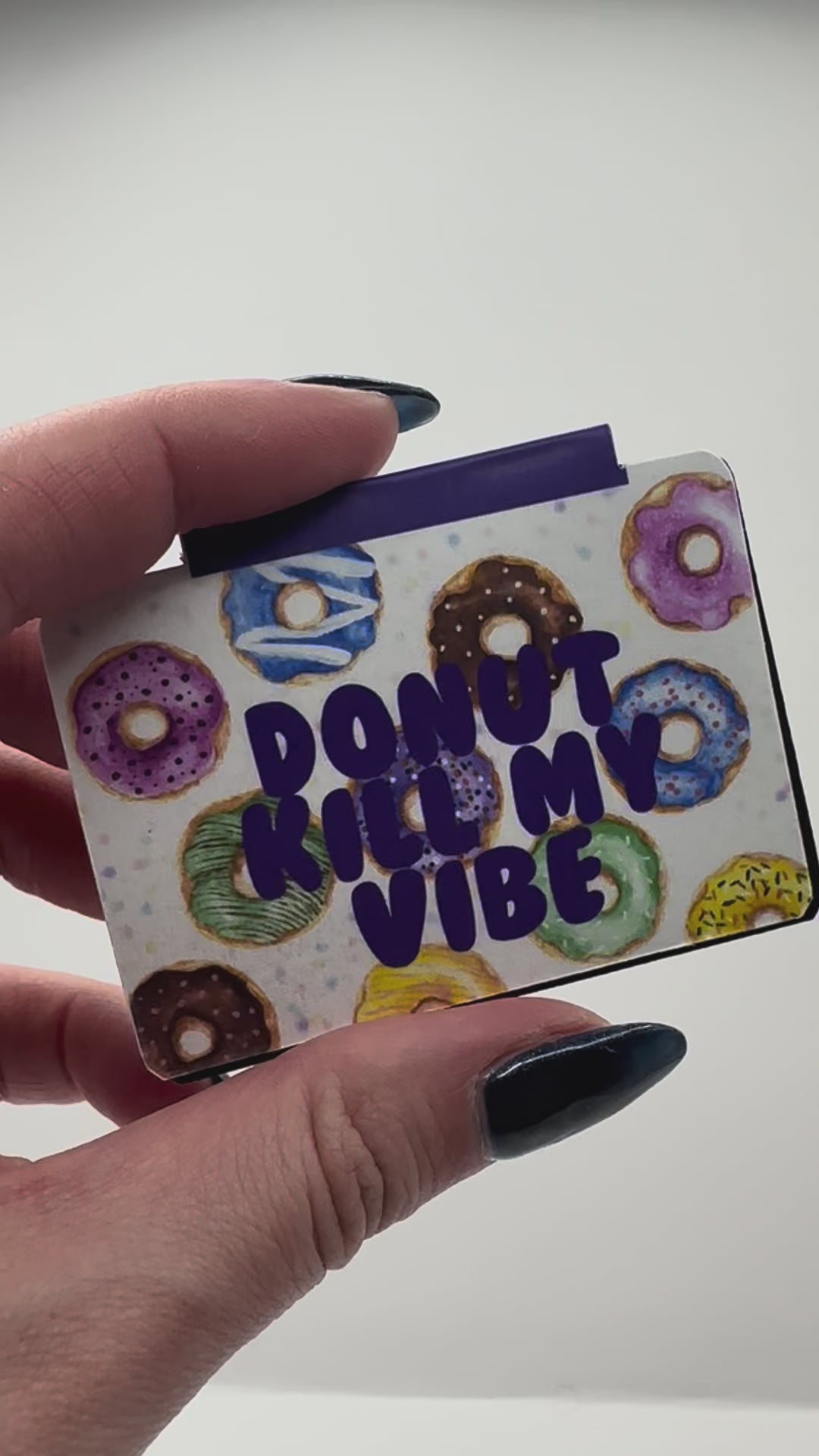 Video of magnetic bookmark featuring hand drawn donuts and text 'donut kill my vibe'