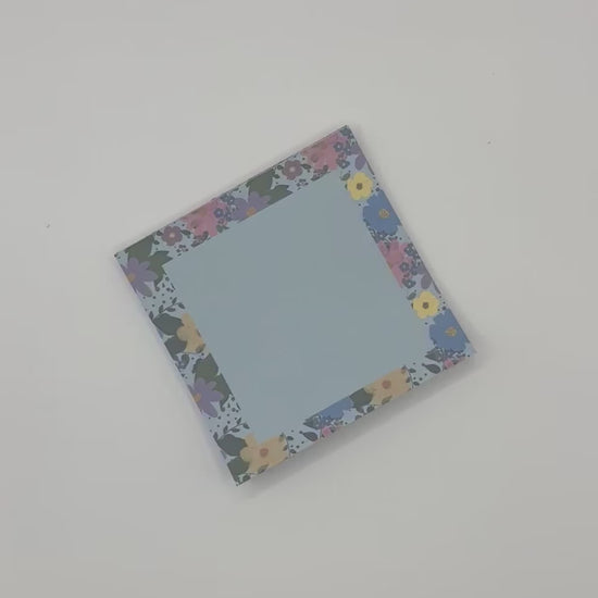 showcasing floral memo pad