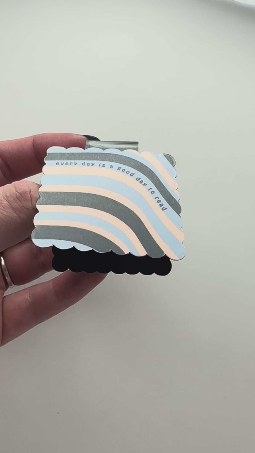 Video of colorful magnetic bookmark with text 'every day is a good day to read'