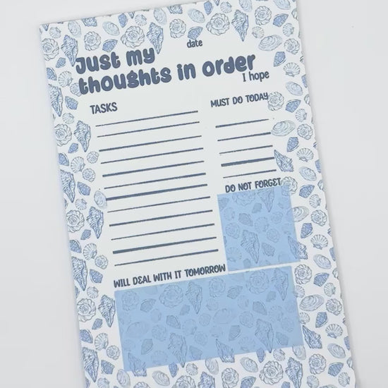 showcasing a notepad with text 'Just my thoughts'